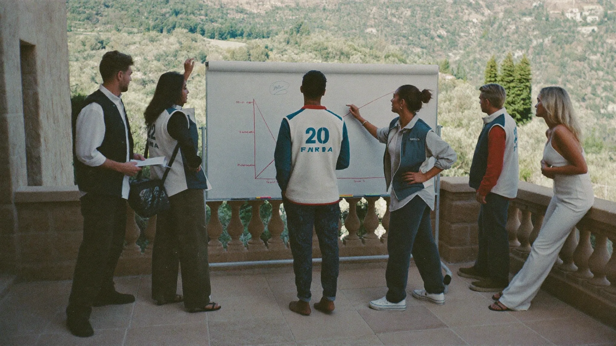 Whiteboard huddle outside the villa